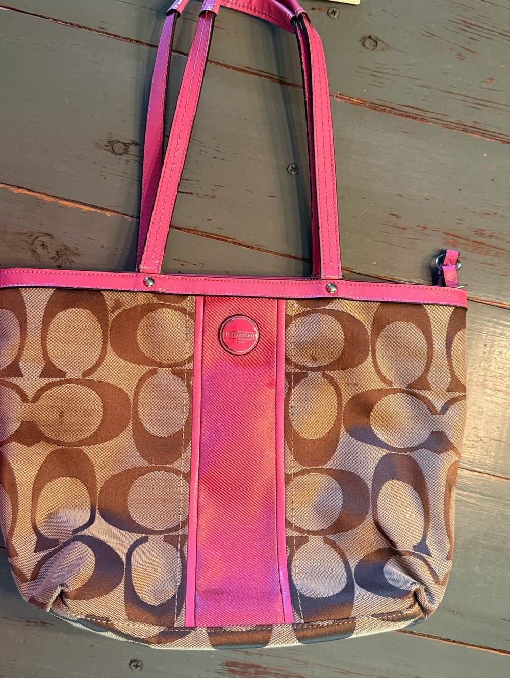 Coach Brown Tote with Pink Trim.  Has a few stains but not too noticeable.